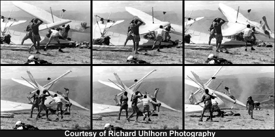 A dust devil wreaks havoc on assembled hang gliders